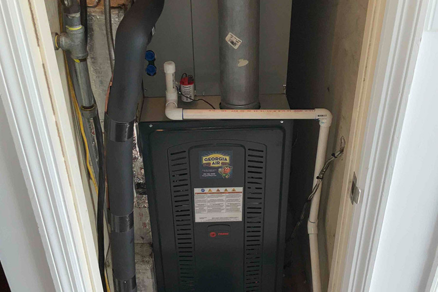 Installed furnace system with a Georgia Air service sticker