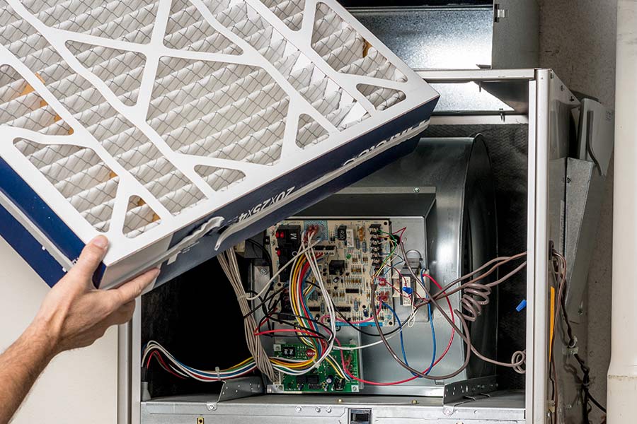 Open furnace showing wiring and component