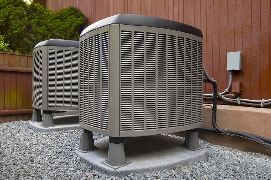 Two Energy-efficient heat pumps outside a home