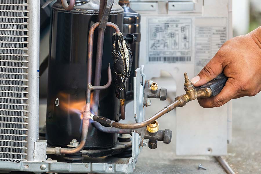 AC repair using blowtorch