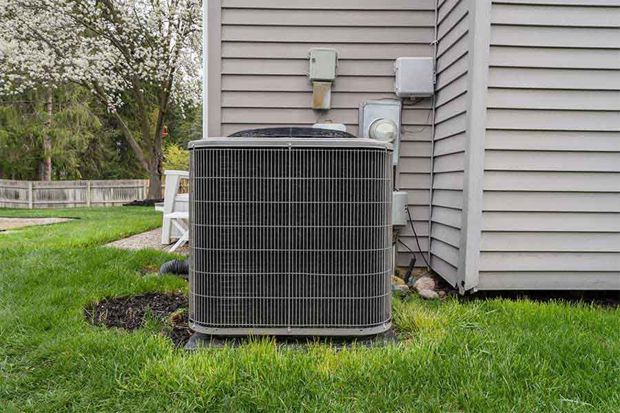 Outdoor AC unit beside house