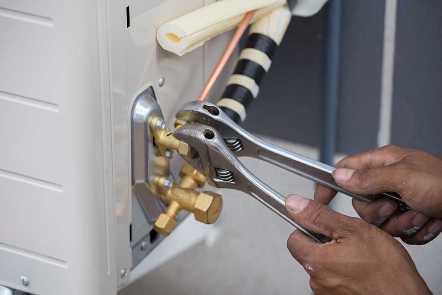 AC repair using adjustable wrenches