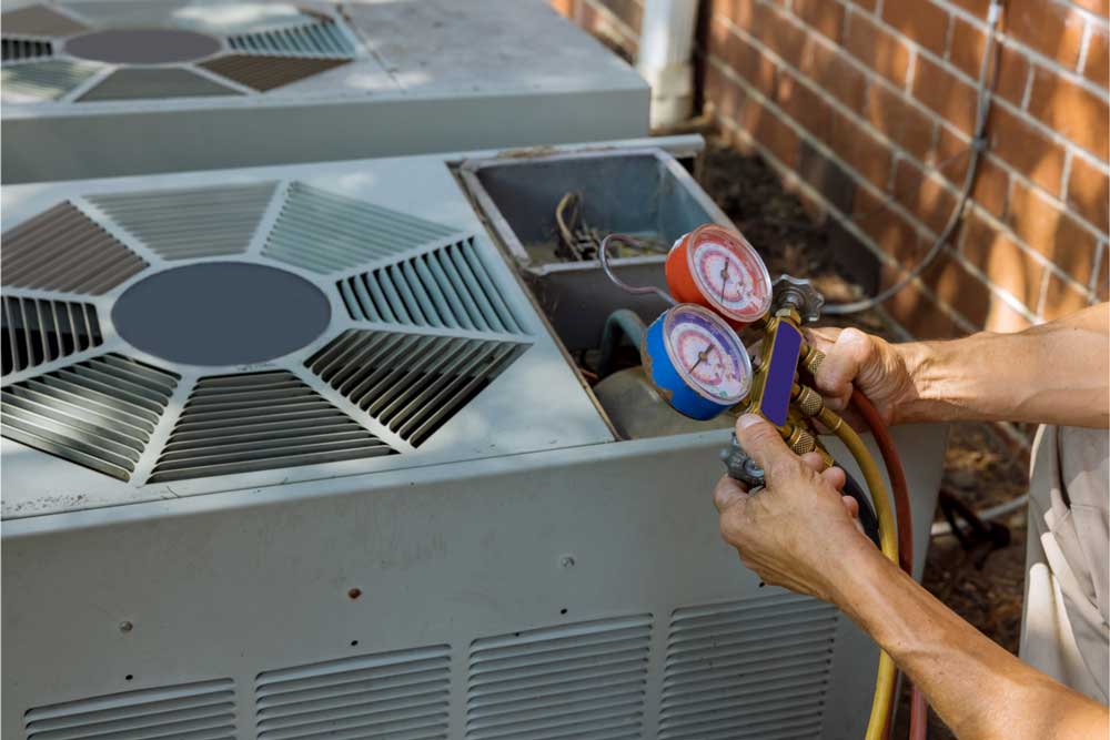 Technician checking AC refrigerant levels