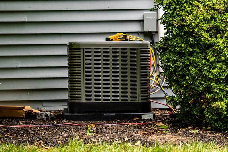 HVAC technician restoring proper refrigerant charge in a residential AC system in Richmond Hill, GA
